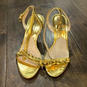 Michael Kors gold Strappy heels with bow and metal studs across the toe size 5